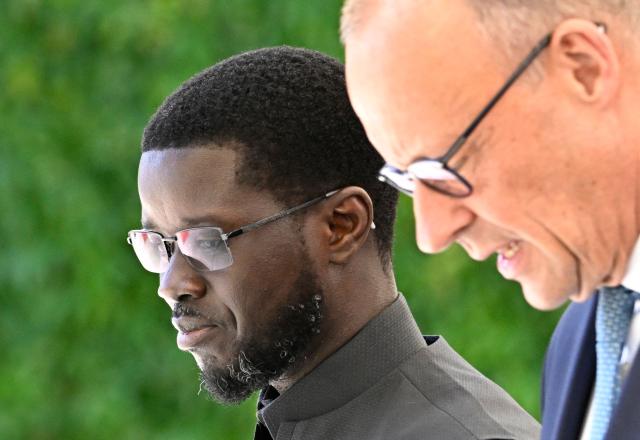 German Chancellor Friedrich Merz (R) welcomes Senegal's President Bassirou Diomaye Faye at the Chancellery in Berlin on June 23, 2026. (Photo by Tobias SCHWARZ / AFP)