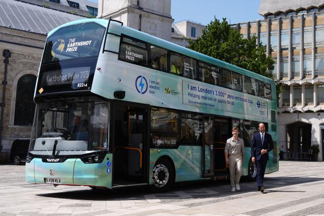 Britain's Prince William, Prince of Wales alongside Australian conservationist Robert Irwin depart a bus to attend the Climate Innovation Forum at the Guildhall in central London, on June 23, 2026.  (Photo by Jordan Pettitt / POOL / AFP)