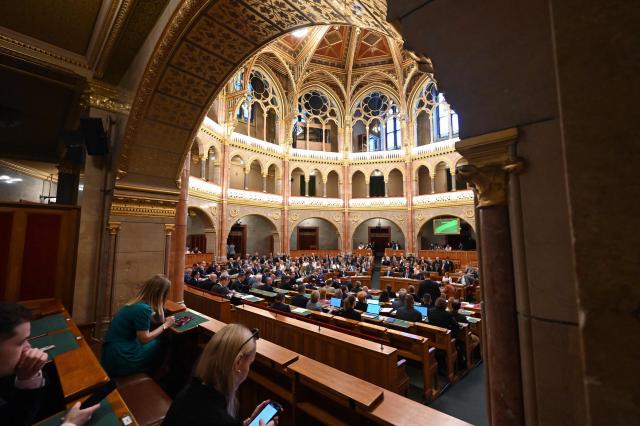 A general view taken on June 23, 2026 shows members of parliament in the main hall of Parliament during an extraordinary session of the National Assembly. Hungarian lawmakers on June 23 approved anti-corruption measures, part of new Prime Minister Peter Magyar's sweeping reform drive and aimed at helping the country get billions of euros in withheld European Union funds. The EU announced late last month it would unlock more than 16 billion euros (USD 18 billion) for Hungary that had been frozen over rule-of-law concerns during nationalist Viktor Orban's rule, if Budapest stays on track with a major reform push. (Photo by Attila KISBENEDEK / AFP)
