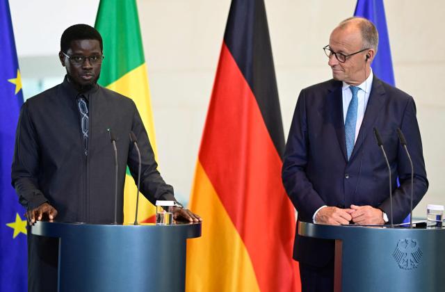 German Chancellor Friedrich Merz (R) and Senegal's President Bassirou Diomaye Faye give a joint press conference at the Chancellery in Berlin on June 23, 2026. (Photo by John MACDOUGALL / AFP)