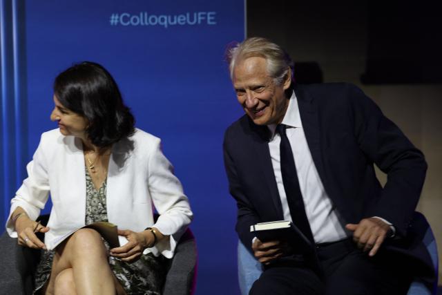 French member of the Parliament Aurélie Trouvé (L) and former French prime minister Dominique de Villepin react during the 14th UFE (French Electricty Union) conference in Paris on June 23, 2026. (Photo by MEHDI FEDOUACH / AFP)