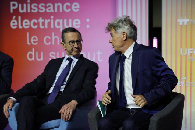 Les Republicains (LR) right wing party president Bruno Retailleau (Left) reacts next to National secretary of French far-left Communist party (PCF) Fabien Roussel during the 14th UFE (French Electricty Union) conference in Paris on June 23, 2026. (Photo by MEHDI FEDOUACH / AFP)