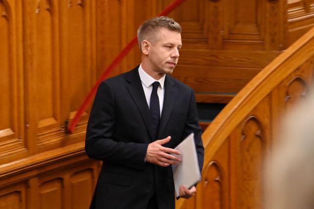 Hungarian Prime Minister Peter Magyar leaves the lectern after his speech before the agenda in the main hall of the Parliament on June 23, 2026, during an extraordinary session of the National Assembly. Hungarian lawmakers on June 23 approved anti-corruption measures, part of new Prime Minister Peter Magyar's sweeping reform drive and aimed at helping the country get billions of euros in withheld European Union funds. The EU announced late last month it would unlock more than 16 billion euros (USD 18 billion) for Hungary that had been frozen over rule-of-law concerns during nationalist Viktor Orban's rule, if Budapest stays on track with a major reform push. (Photo by Attila KISBENEDEK / AFP)