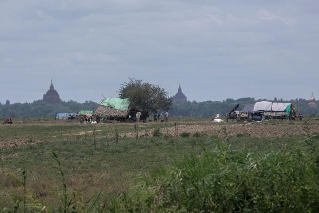 This photo taken on June 21, 2026 shows makeshift shelters, housing people displaced by fighting between Myanmar's military and the People's Defence Forces (PDF) in Myit Chay, on the grounds of a monastery near Pakokku in Myanmar's Magway region. (Photo by AFP)