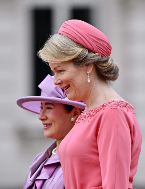 Japan's Empress Masako (L) and Queen Mathilde of Belgium speak together during an official welcoming ceremony as part of a state visit to Belgium, at the Royal Palace in Brussels on June 23, 2026. (Photo by ERIC LALMAND / Belga / AFP) / Belgium OUT