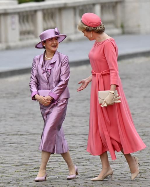 Japan's Empress Masako (L) and Queen Mathilde of Belgium speak together during an official welcoming ceremony as part of a state visit to Belgium, at the Royal Palace in Brussels on June 23, 2026. (Photo by ERIC LALMAND / Belga / AFP) / Belgium OUT