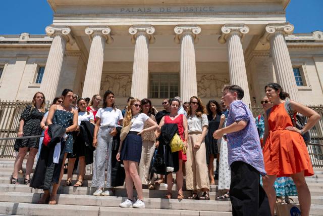 Magistrates gather outside the Marseille's Magistrates' Court, on June 23, 2026 to protest following the government's sanctions on a magistrate and two gendarmes from the Gers region following the findings of a report commissioned after the death of young Lyhanna. In the wake of the publication of the preliminary report by the inspection team set up following Lyhanna’s death, magistrates’ unions on June 23, 2026 expressed regret at the decision to apportion blame rather than address the structural difficulties faced by magistrates. (Photo by Miguel MEDINA / AFP)