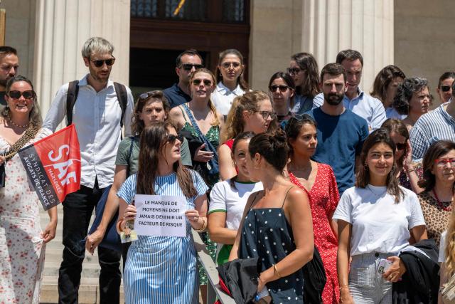 Magistrates gather outside the Marseille's Magistrates' Court, on June 23, 2026 to protest following the government's sanctions on a magistrate and two gendarmes from the Gers region following the findings of a report commissioned after the death of young Lyhanna. In the wake of the publication of the preliminary report by the inspection team set up following Lyhanna’s death, magistrates’ unions on June 23, 2026 expressed regret at the decision to apportion blame rather than address the structural difficulties faced by magistrates. (Photo by Miguel MEDINA / AFP)