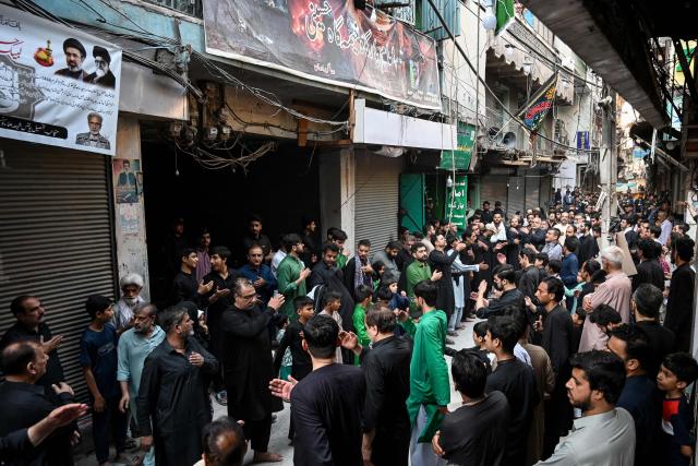 Shiite Muslims take part in a religious procession on the seventh day of Ashura during the Islamic holy month of Muharram in Peshawar on June 23, 2026. (Photo by Abdul MAJEED / AFP)