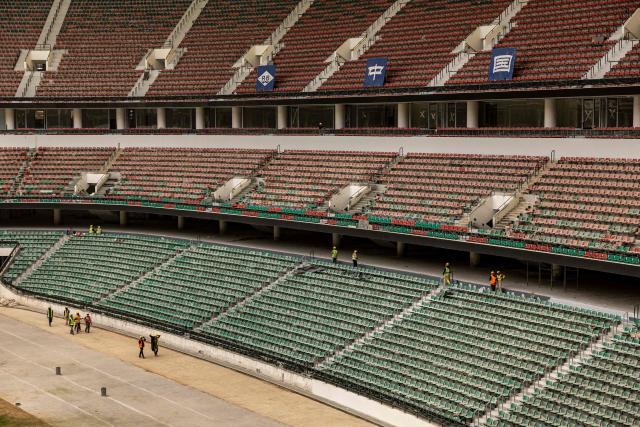 Construction workers install seats at the Raila Odinga International Stadium, also known as Talanta Sports Stadium, a 60,000-seat national stadium under construction in Nairobi on June 23, 2026, ahead the Africa Cup of Nations (AFCON) scheduled for 2027. (Photo by SIMON MAINA / AFP)