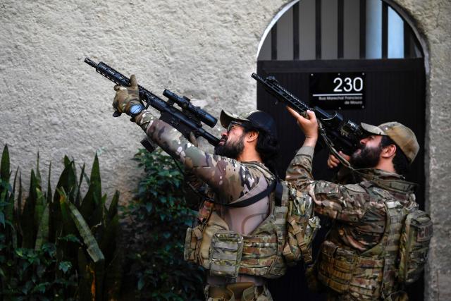 Brazilian Special Police forces take part in the Operation Containment at the Santa Marta favela, in Rio de Janeiro, Brazil, on June 23, 2026. The operation targets alleged members linked to the Comando Vermelho drug trafficking organization as authorities seek to contain the gang's territorial expansion and dismantle its criminal infrastructure. (Photo by Daniel RAMALHO / AFP)