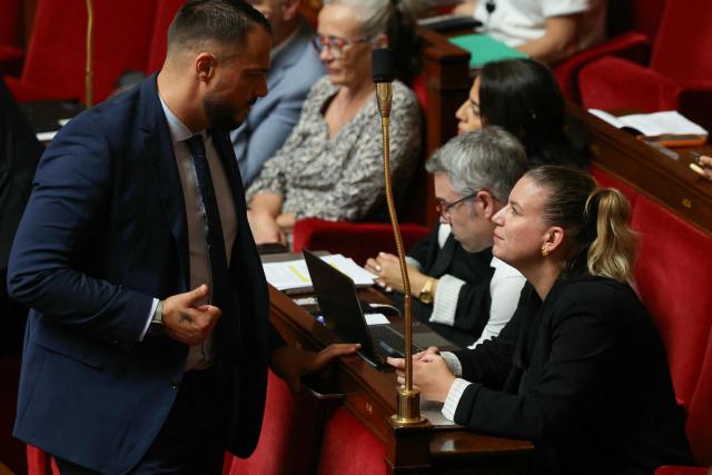 La France Insoumise - Nouveau Front Populaire's MP Sebastien Delogu (L) looks at President of La France Insoumise - Nouveau Front Populaire parliamentary group Mathilde Panot (R) as they attend a session of questions to the government at The National Assembly, France's lower house of parliament in Paris on June 23, 2026. (Photo by Alain JOCARD / AFP)