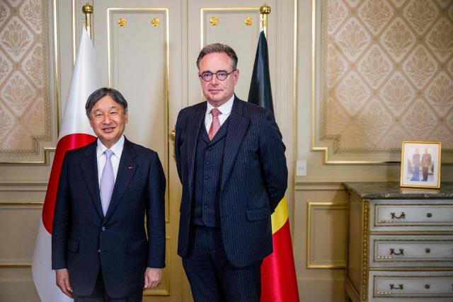Japan's Emperor Naruhito (L) and Belgium's Prime Minister Bart De Wever pose ahead of a meeting at the Lambermont Prime Minister's official residence in Brussels on June 23, 2026, during the official state visit of the Japanese Emperor and Empress to Belgium. (Photo by JASPER JACOBS / Belga / AFP) / Belgium OUT