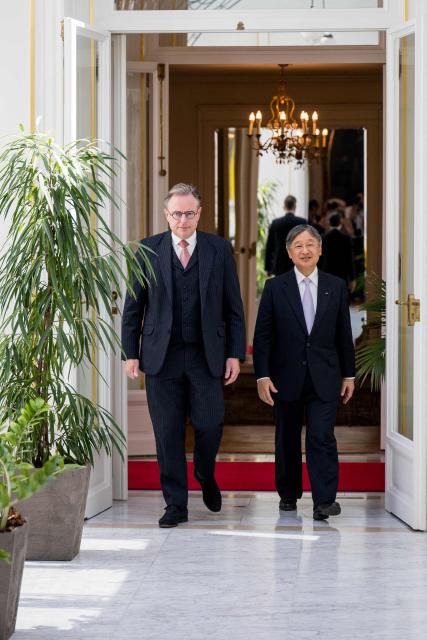 Japan's Emperor Naruhito (R) and Belgium's Prime Minister Bart De Wever arrive for a meeting at the Lambermont Prime Minister's official residence in Brussels on June 23, 2026, during the official state visit of the Japanese Emperor and Empress to Belgium. (Photo by JASPER JACOBS / Belga / AFP) / Belgium OUT
