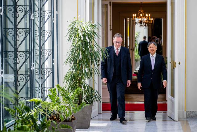 Japan's Emperor Naruhito (R) and Belgium's Prime Minister Bart De Wever arrive for a meeting at the Lambermont Prime Minister's official residence in Brussels on June 23, 2026, during the official state visit of the Japanese Emperor and Empress to Belgium. (Photo by JASPER JACOBS / Belga / AFP) / Belgium OUT