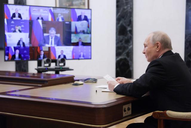 In this pool photograph distributed by the Russian state agency Sputnik, Russia's President Vladimir Putin chairs a meeting with members of the government via videoconference in Moscow on June 23, 2026. (Photo by Gavriil Grigorov / POOL / AFP)