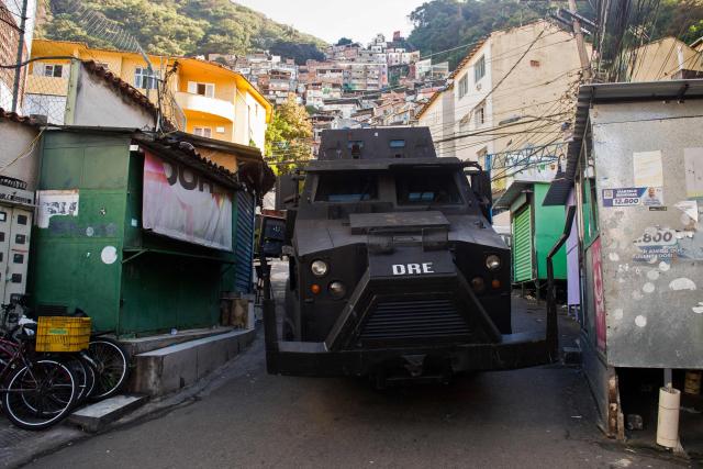 A armored vehicule patrols a street during the Operation Containment at the Santa Marta favela, in Rio de Janeiro, Brazil, on June 23, 2026. The operation targets alleged members linked to the Comando Vermelho drug trafficking organization as authorities seek to contain the gang's territorial expansion and dismantle its criminal infrastructure. (Photo by Daniel RAMALHO / AFP)