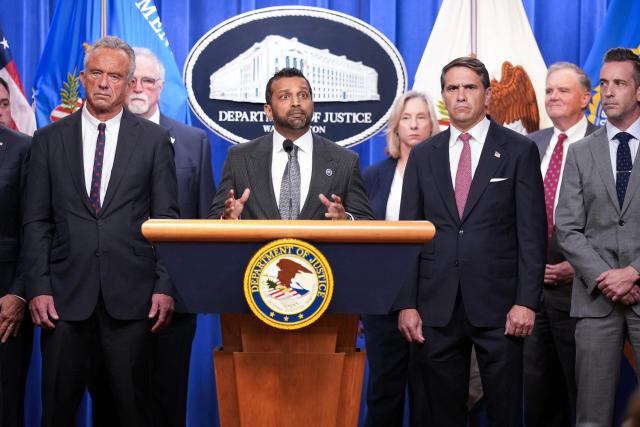 FBI Director Kash Patel (C) flanked by Acting Attorney General Todd Blanche (R) and US Secretary of Health and Human Services Robert F. Kennedy Jr. (L)
, speaks during a press conference announcing annual healthcare fraud takedown results at the Department of Justice in Washington, DC on June 23, 2026. (Photo by Ken Cedeno / AFP)