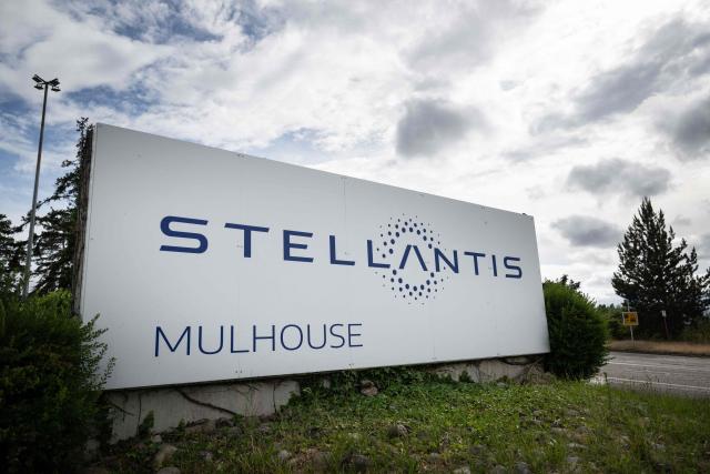 (FILES) This photograph shows the panel at the main entrance of the Stellantis automotive manufacturer factory in Sausheim, near Mulhouse, eastern France, on June 2, 2026. The CGT union at the Stellantis plant in Mulhouse has filed a strike notice from June 23 to June 28, 2026, to protest the working conditions of employees suffering from the extreme heat. (Photo by SEBASTIEN BOZON / AFP)