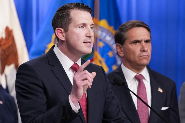 US Assistant Attorney General of the Justice Department's Fraud Division Colin McDonald (R), joined by Acting Attorney General Todd Blanche (R) speaks during a press conference announcing annual healthcare fraud takedown results at the Department of Justice in Washington, DC on June 23, 2026. (Photo by Ken Cedeno / AFP)