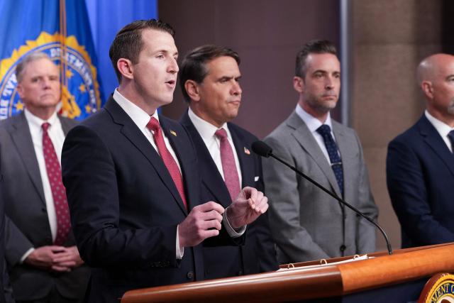 US Assistant Attorney General of the Justice Department's Fraud Division Colin McDonald (2L), joined by Acting Attorney General Todd Blanche (C) speaks during a press conference announcing annual healthcare fraud takedown results at the Department of Justice in Washington, DC on June 23, 2026. (Photo by Ken Cedeno / AFP)