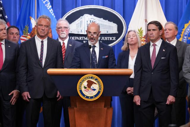 Drug Enforcement Administration (DEA) Administrator Terry Cole (C) joined by, L-R, Medicare and Medicaid Administrator Mehmet Oz, US Secretary of Health and Human Services Robert F. Kennedy Jr., and Acting Attorney General Todd Blanche, speaks during a press conference announcing annual healthcare fraud takedown results at the Department of Justice in Washington, DC on June 23, 2026. (Photo by Ken Cedeno / AFP)