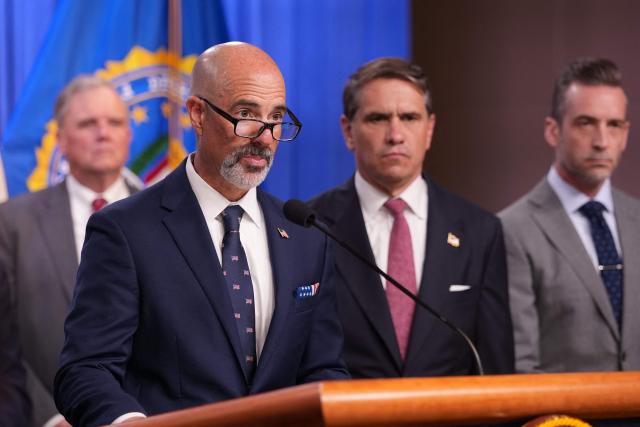 Drug Enforcement Administration (DEA) Administrator Terry Cole (2L) joined by, L-R, Acting Attorney General Todd Blanche (2R), speaks during a press conference announcing annual healthcare fraud takedown results at the Department of Justice in Washington, DC on June 23, 2026. (Photo by Ken Cedeno / AFP)
