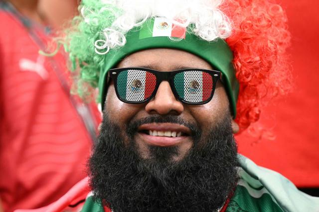 A football fan with Mexico fan gear poses prior to the   2026 World Cup Group K football match between Portugal and Uzbekistan at the Houston Stadium in Houston on June 23, 2026.  (Photo by RONALDO SCHEMIDT / AFP)