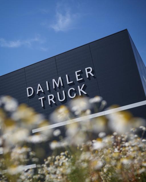 The lettering Daimler Truck is seen at the warehouse of the new Daimler Truck Global Parts Center (GPC) in Halberstadt, eastern Germany, on June 23, 2026. Following its opening in 2025, the company has brought the logistics center fully online and now ships to 170 countries worldwide. (Photo by Ronny HARTMANN / AFP)