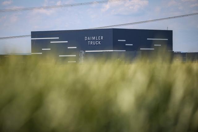 The lettering Daimler Truck is seen at the warehouse of the new Daimler Truck Global Parts Center (GPC) in Halberstadt, eastern Germany, on June 23, 2026. Following its opening in 2025, the company has brought the logistics center fully online and now ships to 170 countries worldwide. (Photo by Ronny HARTMANN / AFP)