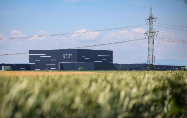 The lettering Daimler Truck is seen at the warehouse of the new Daimler Truck Global Parts Center (GPC) in Halberstadt, eastern Germany, on June 23, 2026. Following its opening in 2025, the company has brought the logistics center fully online and now ships to 170 countries worldwide. (Photo by Ronny HARTMANN / AFP)