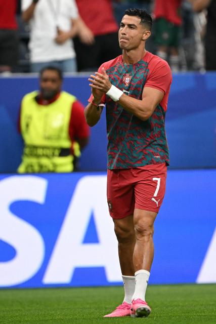 Portugal's forward #07 Cristiano Ronaldo applauds during warm up prior to the 2026 World Cup Group K football match between Portugal and Uzbekistan at the Houston Stadium in Houston on June 23, 2026.  (Photo by RONALDO SCHEMIDT / AFP)