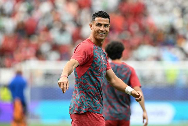 Portugal's forward #07 Cristiano Ronaldo gestures during warm up prior to the 2026 World Cup Group K football match between Portugal and Uzbekistan at the Houston Stadium in Houston on June 23, 2026.  (Photo by RONALDO SCHEMIDT / AFP)