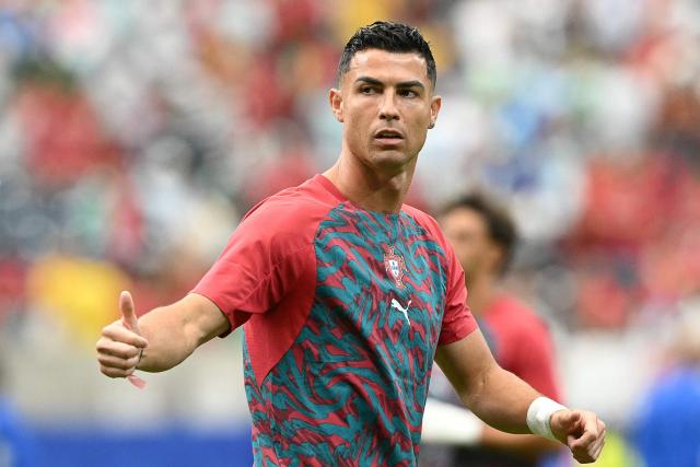 Portugal's forward #07 Cristiano Ronaldo gestures during warm up prior to the 2026 World Cup Group K football match between Portugal and Uzbekistan at the Houston Stadium in Houston on June 23, 2026.  (Photo by RONALDO SCHEMIDT / AFP)