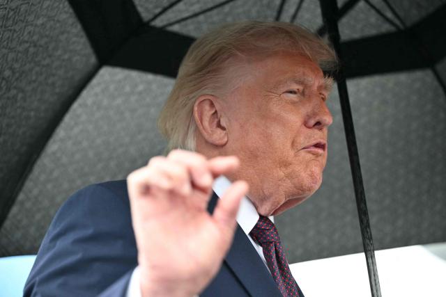 US President Donald Trump speaks to the press after stepping off Air Force One at Reading Regional Airport (RDG) in Berks County, Pennsylvania, on June 23, 2026. (Photo by Mandel NGAN / AFP)