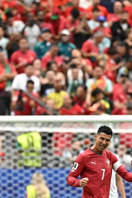 Portugal's forward #07 Cristiano Ronaldo celebrates his team's second goal during the 2026 World Cup Group K football match between Portugal and Uzbekistan at the Houston Stadium in Houston on June 23, 2026.  (Photo by Paul ELLIS / AFP)