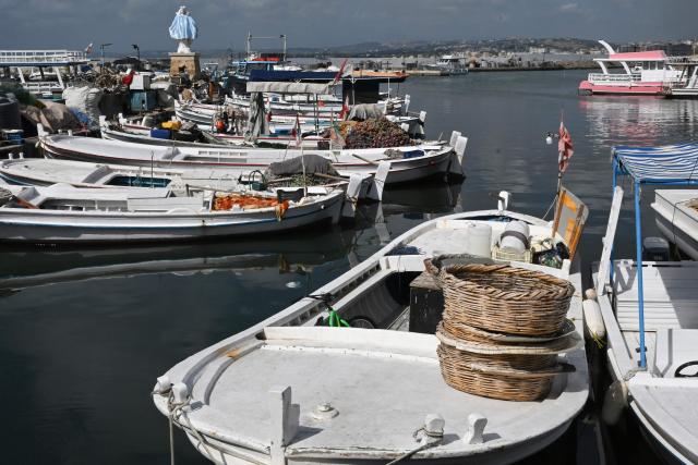 A statue of the Virgin Mary, The Lady of The Seas, overlooks the fishermen port in the southern Lebanese coastal city of Tyre on June 23, 2026, days after the city saw numerous Israeli military strikes. On June 22, 2026, mediators Pakistan and Qatar said that Tehran and Washington had agreed to set up a "de-confliction cell" to limit flare-ups in Lebanon following talks in Switzerland on ending the wider Middle East war, which Tehran has linked to halting the parallel conflict in Lebanon. (Photo by Joseph EID / AFP) / 