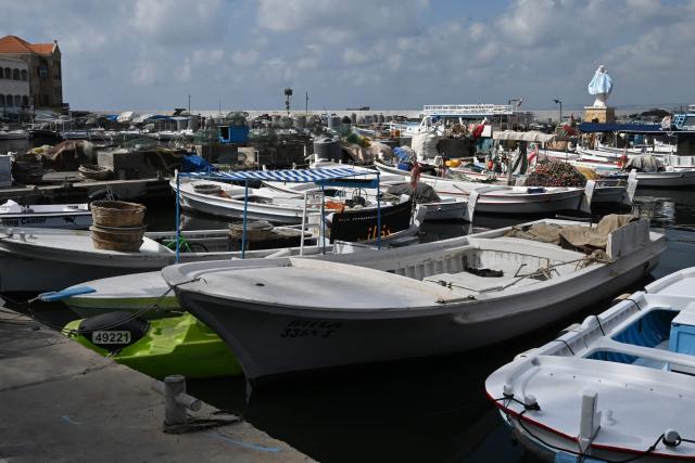 A statue of the Virgin Mary, The Lady of The Seas, overlooks the fishermen port in the southern Lebanese coastal city of Tyre on June 23, 2026, days after the city saw numerous Israeli military strikes. On June 22, 2026, mediators Pakistan and Qatar said that Tehran and Washington had agreed to set up a "de-confliction cell" to limit flare-ups in Lebanon following talks in Switzerland on ending the wider Middle East war, which Tehran has linked to halting the parallel conflict in Lebanon. (Photo by Joseph EID / AFP) / 