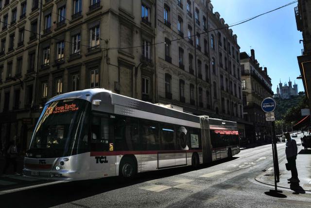 This photograph show bus and pedestrians in the Grenette street in Lyon on June 23, 2026. The Grenette street in central Lyon is testing the cohabitation between the ecologist city council and the Metropolis, which has just swung to the right. (Photo by OLIVIER CHASSIGNOLE / AFP)