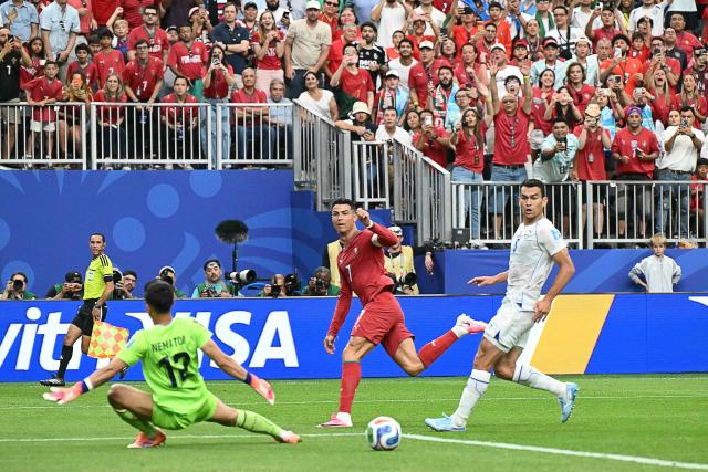 Portugal's forward #07 Cristiano Ronaldo (C) reacts as he scores his team's third goal during the 2026 World Cup Group K football match between Portugal and Uzbekistan at the Houston Stadium in Houston on June 23, 2026. Scotland and Brazil will meet in a 2026 World Cup Group C football match at the Miami Stadium in Miami Gardens on June 24, 2026. (Photo by RONALDO SCHEMIDT / AFP)