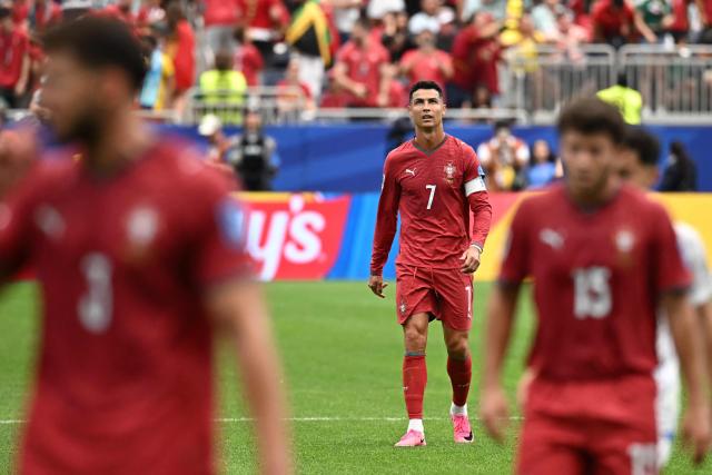 Portugal's forward #07 Cristiano Ronaldo leaves the pitch at half-time of the 2026 World Cup Group K football match between Portugal and Uzbekistan at the Houston Stadium in Houston on June 23, 2026.  (Photo by Paul ELLIS / AFP)