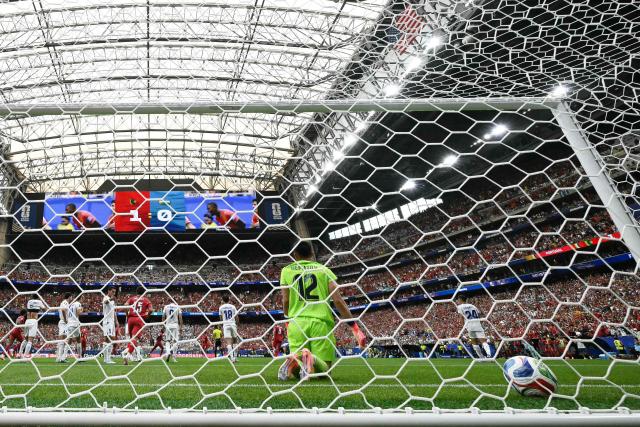 Uzbekistan's goalkeeper #12 Abduvohid Nematov (C0 reacts after conceding Portugal's second goal  during the 2026 World Cup Group K football match between Portugal and Uzbekistan at the Houston Stadium in Houston on June 23, 2026.  (Photo by RONALDO SCHEMIDT / AFP)