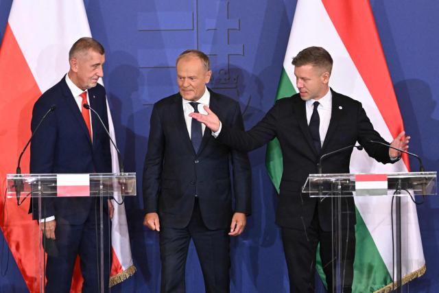 Prime Ministers of the Visegrad countries (L to R) Andrej Babis of Czech Republic, Donald Tusk of Poland,  Peter Magyar of Hungary arrive to deliver a press conference after a meeting of the Visegrad Group (V4) in the Royal Castle of Godollo, Hungary, on June 23, 2026. The Prime Ministers of the Visegrad countries discussed about energy security, migration and EU funds during a meeting aimed to strengthen Central European cooperation and coordinate common regional interests. (Photo by Attila KISBENEDEK / AFP)