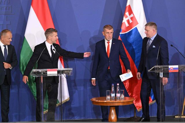Prime Ministers of the Visegrad countries (L to R) Polish Prime Minister Donald Tusk, Hungarian Prime Minister Peter Magyar, Czech Republic's Prime Minister Andrej Babis and Slovakia's Prime Minister Robert Fico arrive to deliver a press conference after a meeting of the Visegrad Group (V4) in the Royal Castle of Godollo, Hungary, on June 23, 2026. The Prime Ministers of the Visegrad countries discussed about energy security, migration and EU funds during a meeting aimed to strengthen Central European cooperation and coordinate common regional interests. (Photo by Attila KISBENEDEK / AFP)