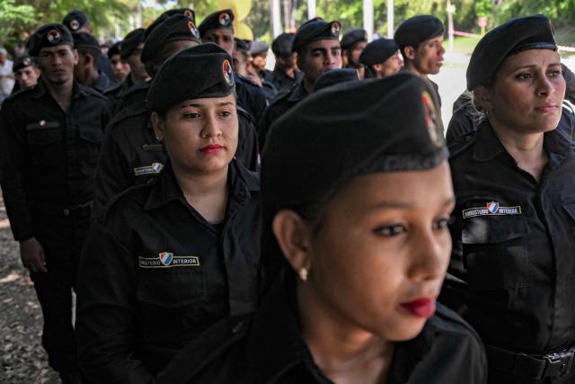 Cuba's soldiers line up in front of the Ministry of the Revolutionary Armed Forces to pay tribute to Commander Ramiro Valdés during his funeral in Havana on June 23, 2026. Ramiro Valdes Menendez, a close associate of brothers Fidel and Raul Castro and founder of the Cuban intelligence services, has died at the age of 94, Cuban President Miguel Diaz-Canel announced on June 21, 2026. (Photo by YAMIL LAGE / AFP)