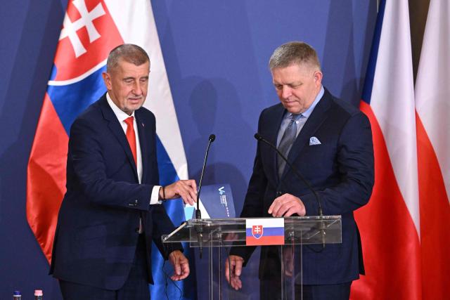 Prime Ministers of the Visegrad countries (L to R) Czech Republic's Prime Minister Andrej Babis and Slovakia's Prime Minister Robert Fico arrive to deliver a press conference after a meeting of the Visegrad Group (V4) in the Royal Castle of Godollo, Hungary, on June 23, 2026. The Prime Ministers of the Visegrad countries discussed about energy security, migration and EU funds during a meeting aimed to strengthen Central European cooperation and coordinate common regional interests. (Photo by Attila KISBENEDEK / AFP)