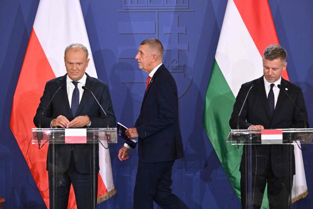 Prime Ministers of the Visegrad countries (L to R) Polish Prime Minister Donald Tusk, Czech Prime Minister Andrej Babis and Hungarian Prime Minister Peter Magyar arrive to deliver a press conference after a meeting of the Visegrad Group (V4) in the Royal Castle of Godollo, Hungary, on June 23, 2026. The Prime Ministers of the Visegrad countries discussed about energy security, migration and EU funds during a meeting aimed to strengthen Central European cooperation and coordinate common regional interests. (Photo by Attila KISBENEDEK / AFP)