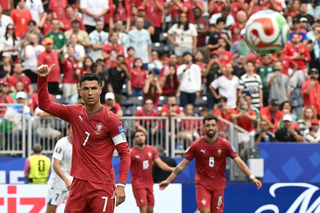 Portugal's forward #07 Cristiano Ronaldo (L) reacts  during the 2026 World Cup Group K football match between Portugal and Uzbekistan at the Houston Stadium in Houston on June 23, 2026.  (Photo by RONALDO SCHEMIDT / AFP)
