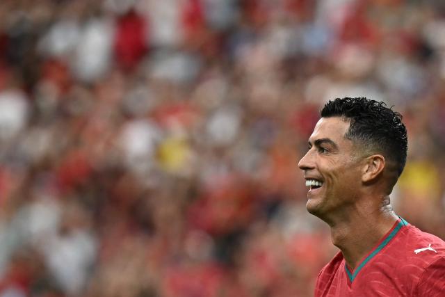 Portugal's forward #07 Cristiano Ronaldo reacts to his team's fourth goal during the 2026 World Cup Group K football match between Portugal and Uzbekistan at the Houston Stadium in Houston on June 23, 2026.  (Photo by Paul ELLIS / AFP)