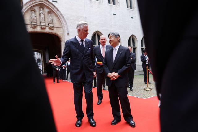 (FROM L) King Philippe - Filip of Belgium, Brussels' mayor Philippe Close and Japanese Emperor Naruhito attend a visit to the City Hall in Brussels on June 23, 2026, during the official state visit of the Japanese Emperor and Empress to Belgium. The Emperor and Empress of Japan visit Belgium from June 20 to 25, 2026. (Photo by NICOLAS ECONOMOU / Belga / AFP) / Belgium OUT